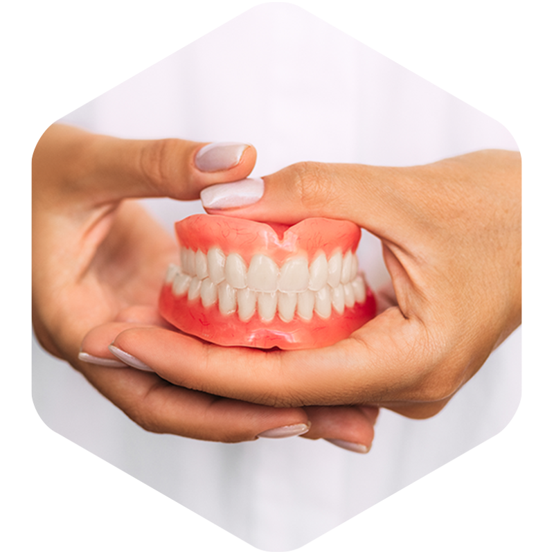 Dentist holding a patient's dentures